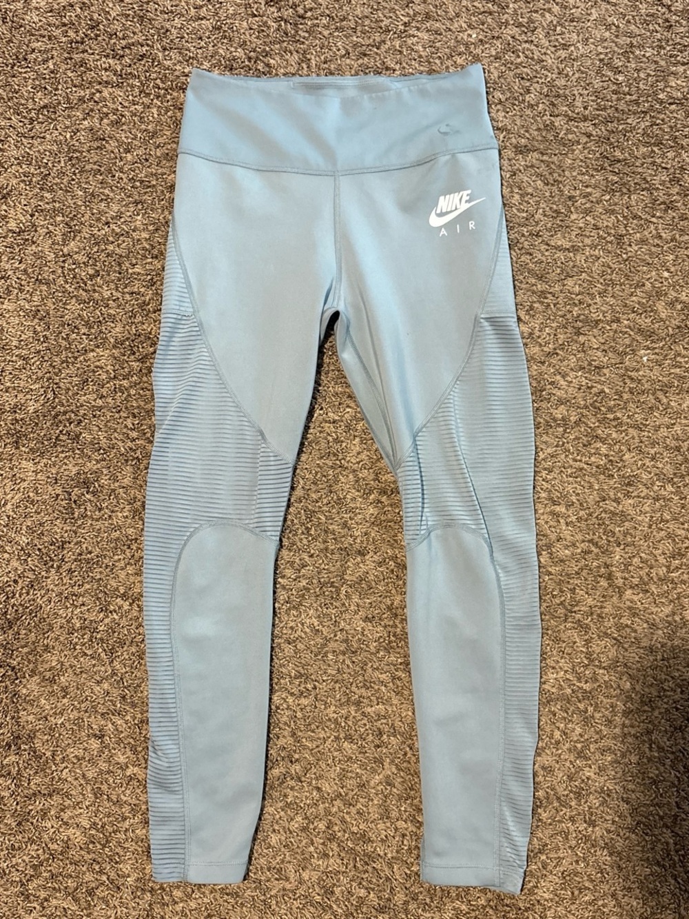 Woman’s size m Nike blue leggings with white logo